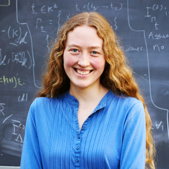 Lauren in front of a blackboard